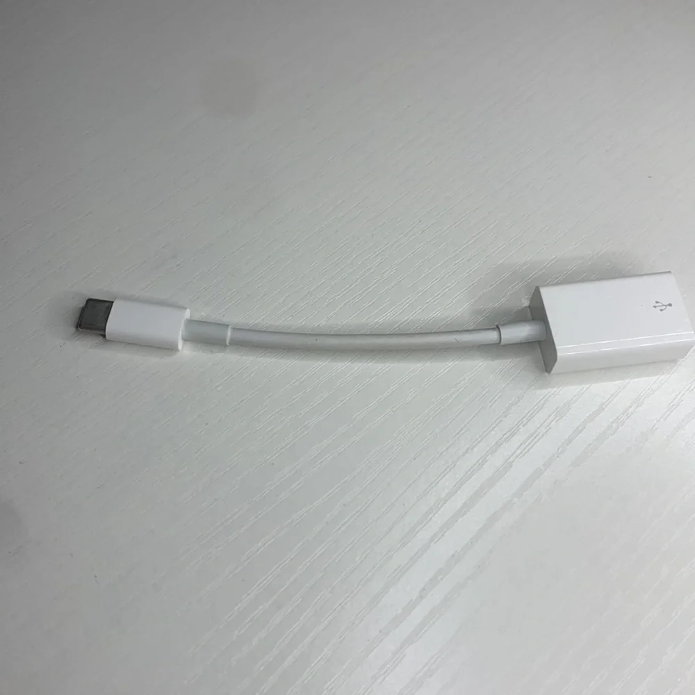 white MacBook adapter